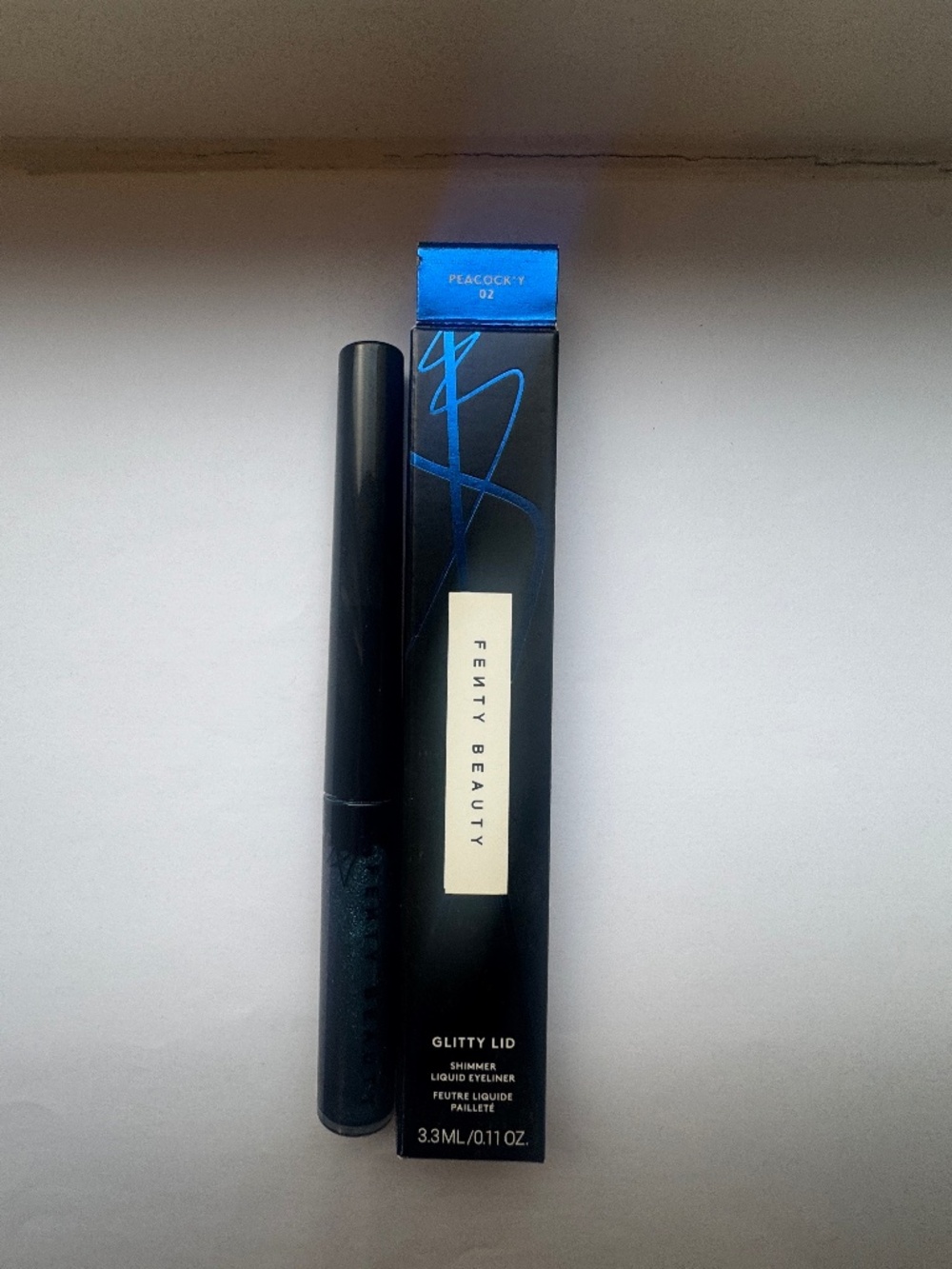 FENTY BEAUTY Glitty Lid Shimmer Liquid Eyeliner in Shade "Peacock’y"